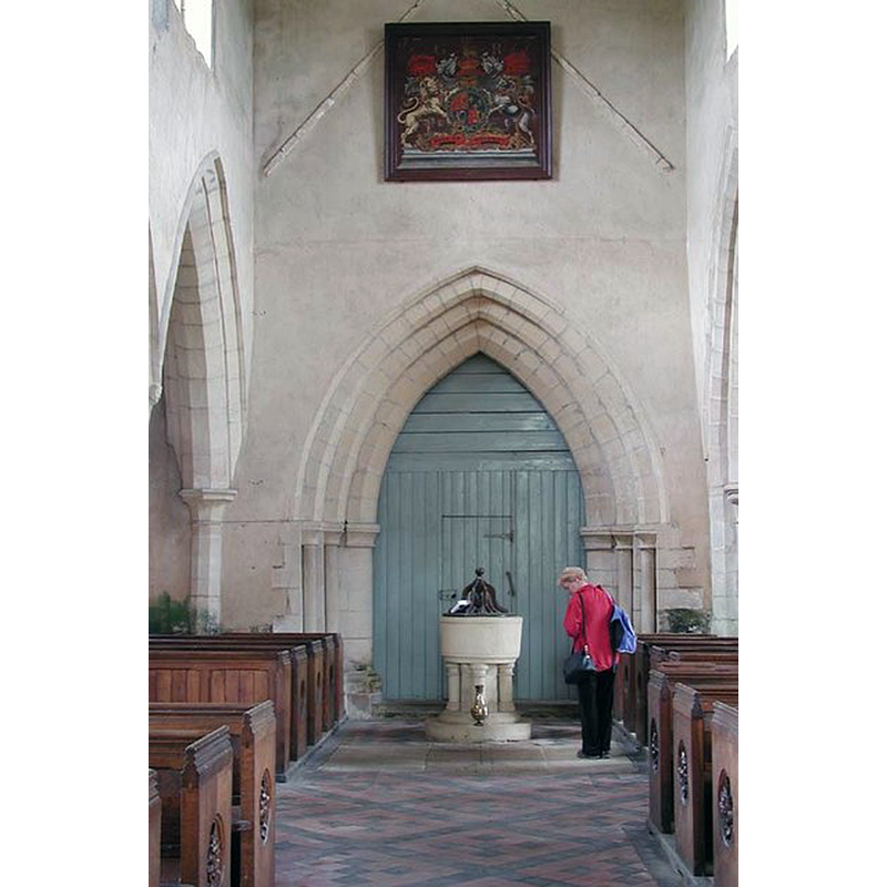 at the west end of the nave, centre aisle