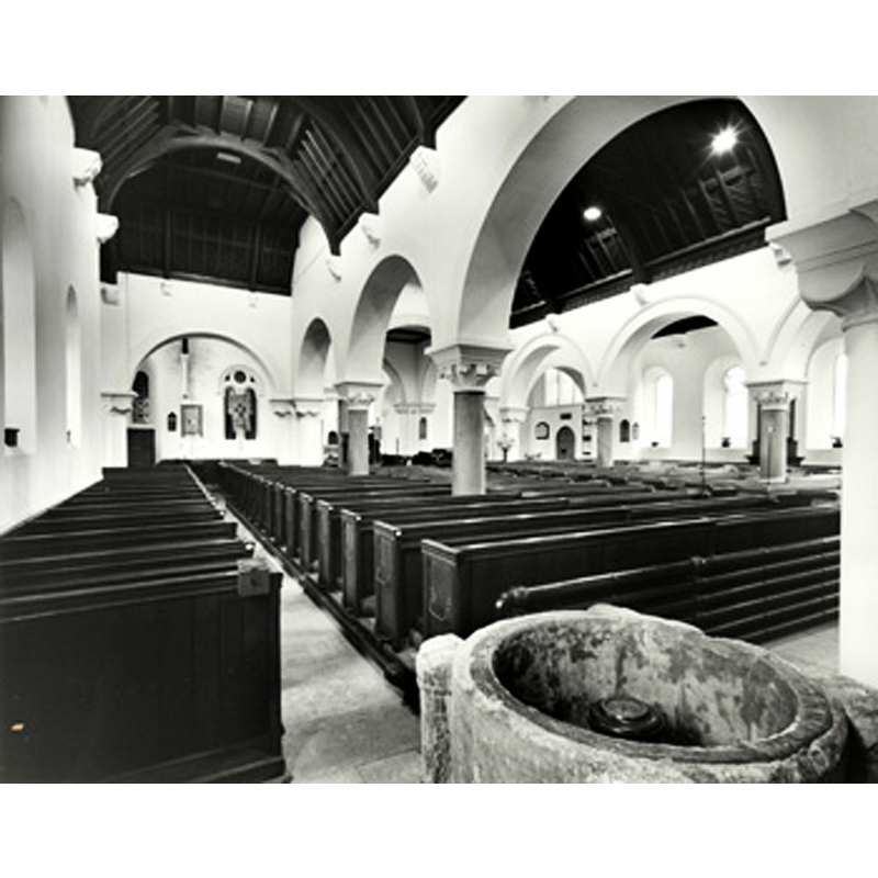 the old font inside  the new church -- Source caption: "Saint Cuthbert's Bedford interior looking west in 1974 [Z50/10/10]"