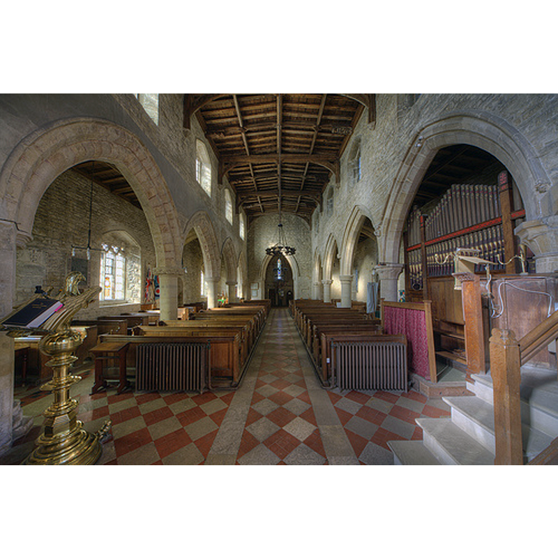 the font is located behind the second pillar of the north arcade