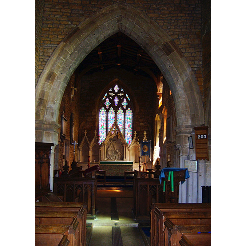 Source caption: "Interior showing the chancel arch, chancel and stone reredos."