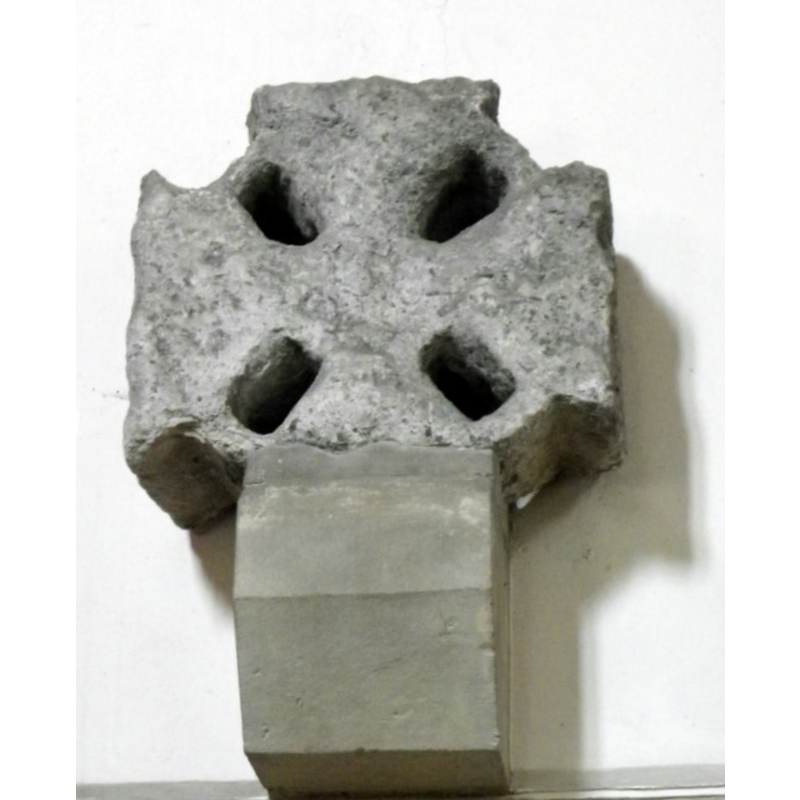 Source caption: "Cross head, St Martin's Church. The head of an Anglo-Saxon wheel cross hangs above the blocked north door." [NB: a church and a priest in Bulmer are recorded in the Domesday survey]