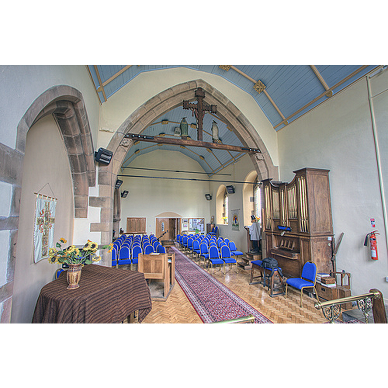 The figure in the pulpit is a dummy with a flower pot on its head.