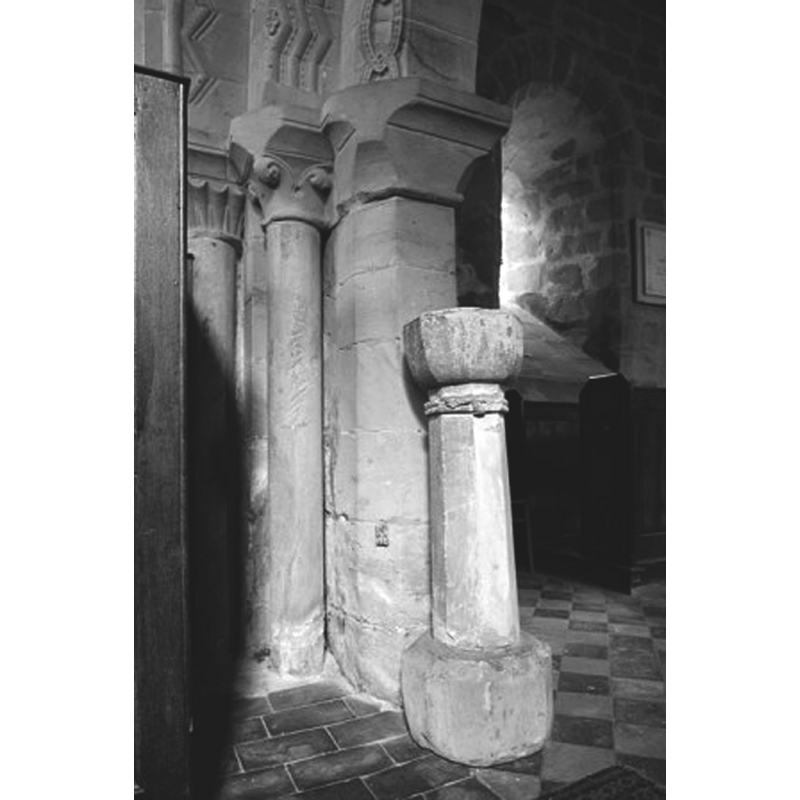the holy-water stoup is located by the south-side pillar of the chancel arch