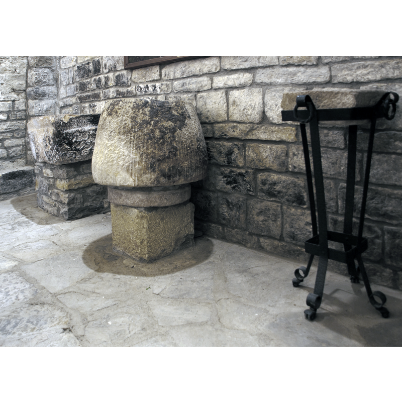 wirth the claimed font at the far back; not known what the metal and stone objects is; perhaps a stoup