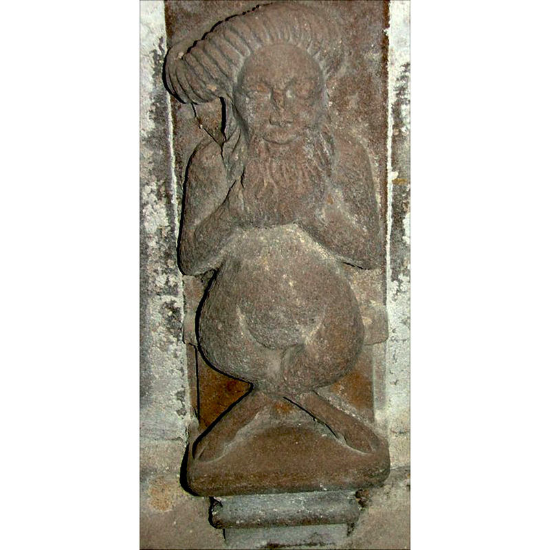 one of the odd-looking cross-legged creatures identified as "beturbanned woodwoses" by S. Knott [cf. FontNotes]; appears to be smirking; hiding his hands in his beard