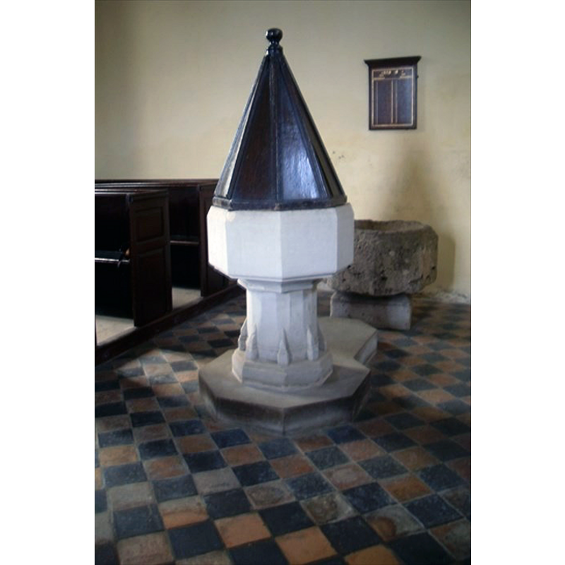 the modern font in the foreground; the old eroded basin in the background