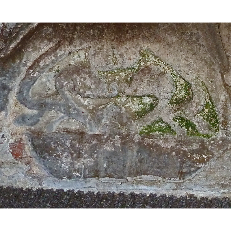 Source caption: "A detail view of one of the lunettes (semi-circular cushion-like ornamentations) at the base of the "Aylesbury" font in the South Porch of All Saints, Wing."