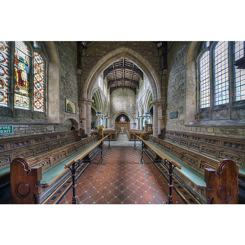 the font at the far [west] end, centre aisle