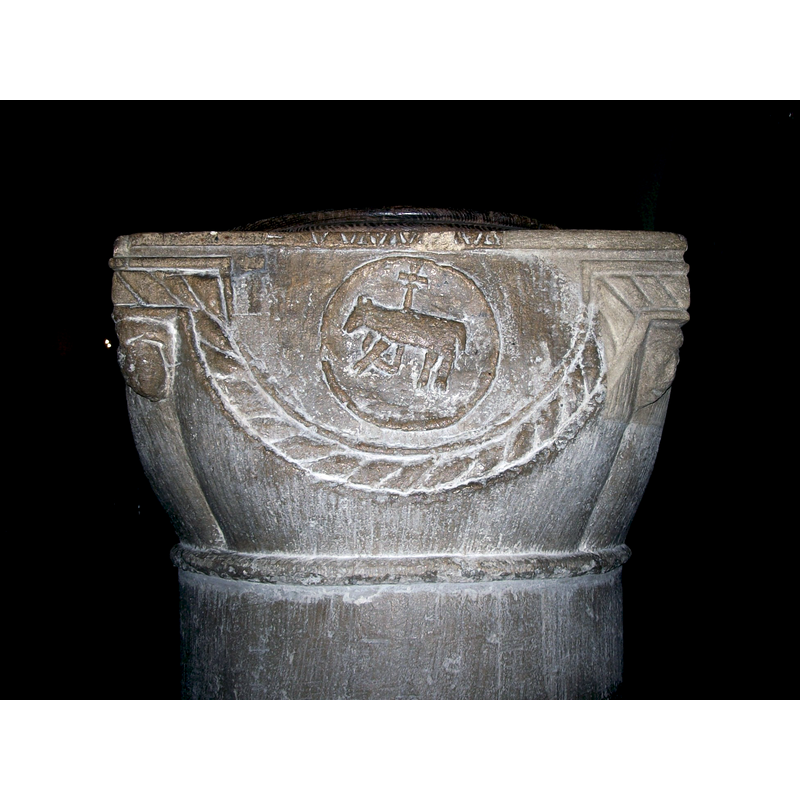 only two of the original heads, badly disfugured, remain; the other two are re-constructions -- the upper right corner of the basin has been re-constructed showing the human face on it; the left corner is original and still shows the contours of a human face