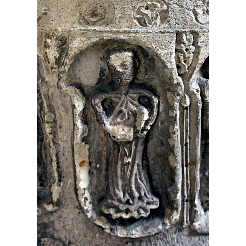 the carved beard is clearly discernible; was he darrying/holding something?