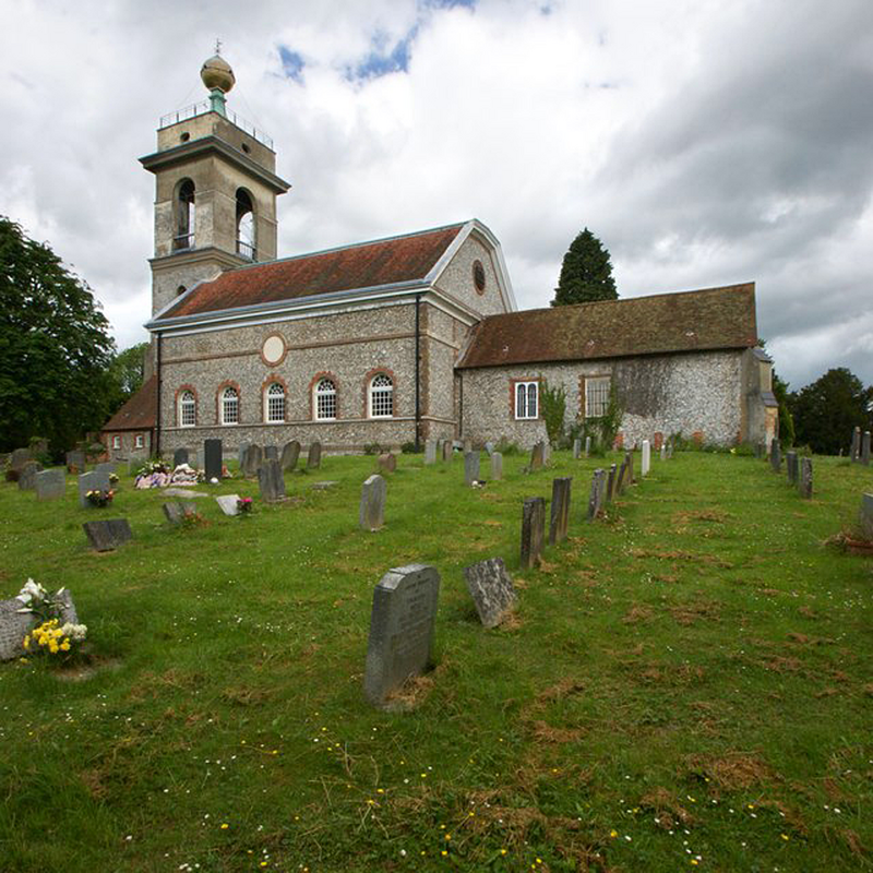 Source caption: "The Church of St Lawrence, West Wycombe. Built in the 14th century and then dramatically changed in 1752. Thirteen days after this photograph was taken it was the 250th anniversary of the rebuilding of the church."