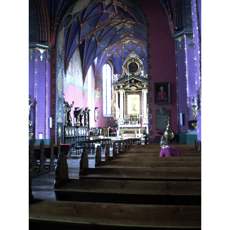 the font and cover are partially visible by the right [south] side of the chancel arch