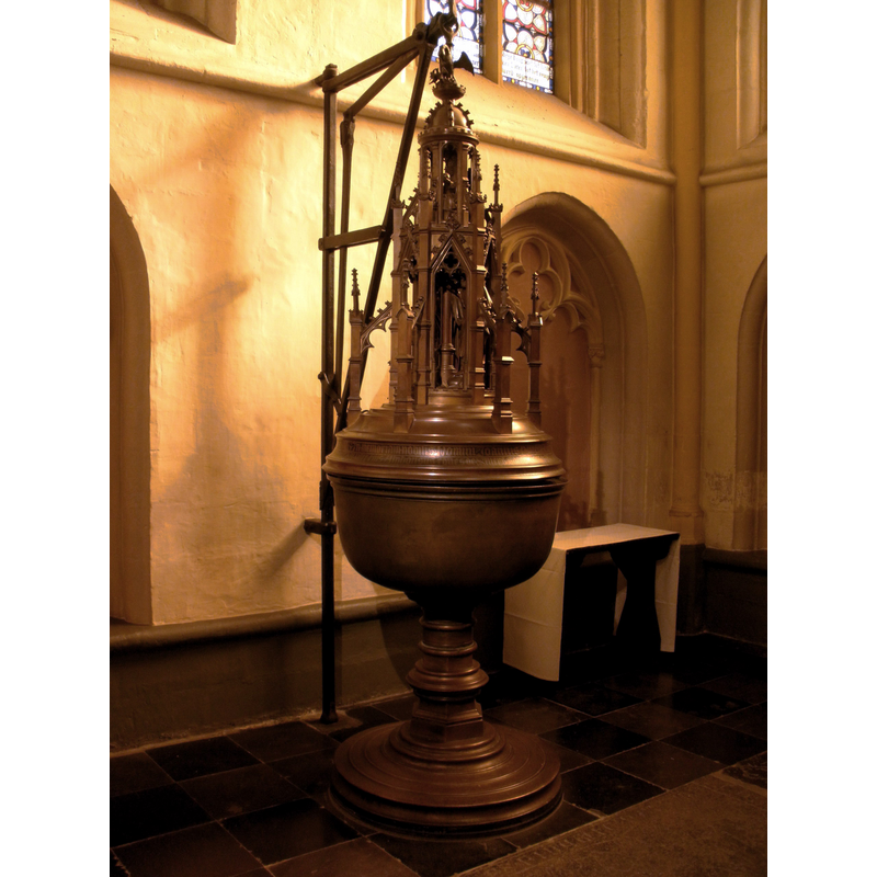 Source caption: "Baptismal font (brass, partly 15th c; the lid was added in 1906) in the baptismal chapel in the Basilica of Saint Servatius, Maastricht, the Netherlands."