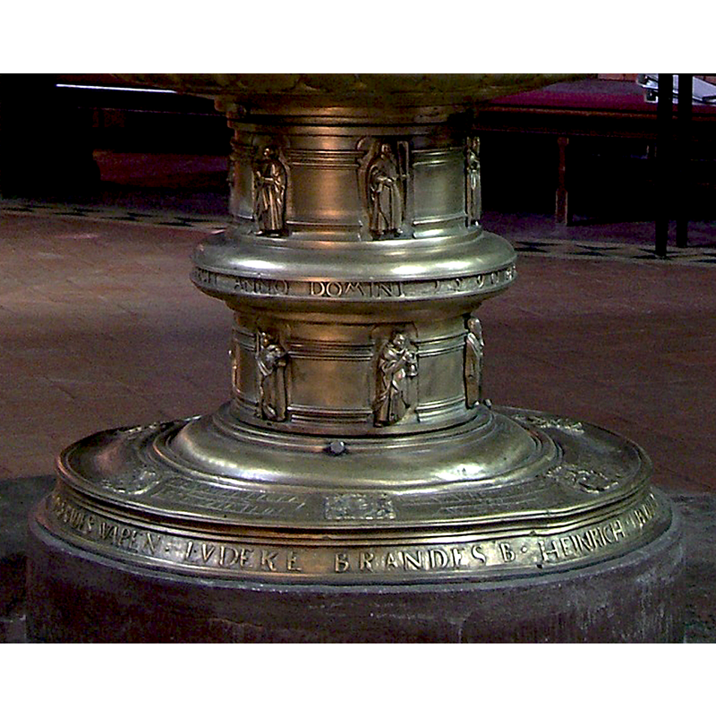 in two rows of six, on the stem of the font; each Apostle bears an identifying symbol