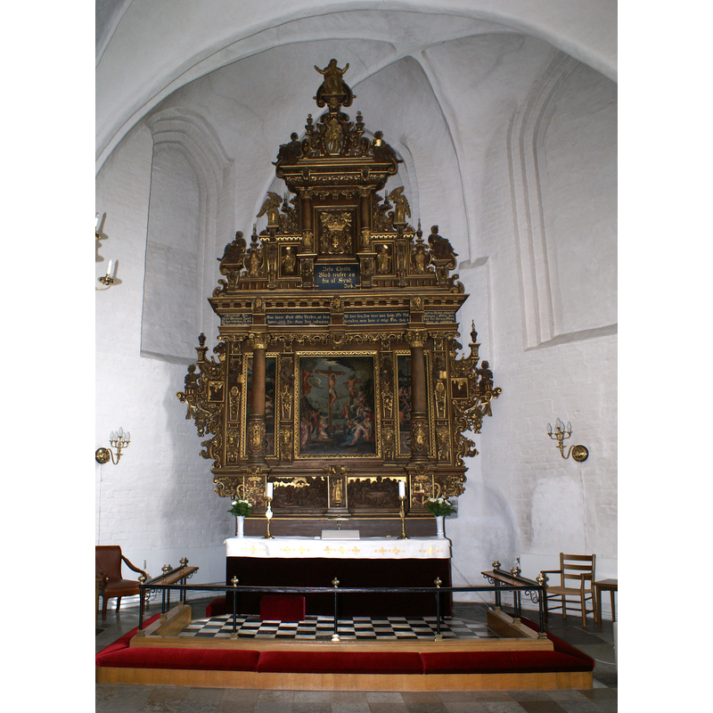Retable of 1616 with paintings from Antonius Clement's workshop in Odense; the workshop was also responsible for the Mecklenburgske anetavle, genealogical table of Sophie of Mecklenburg-Güstrow (1572–1588), dowager queen of Denmark -- the genealogical table hangs in this church