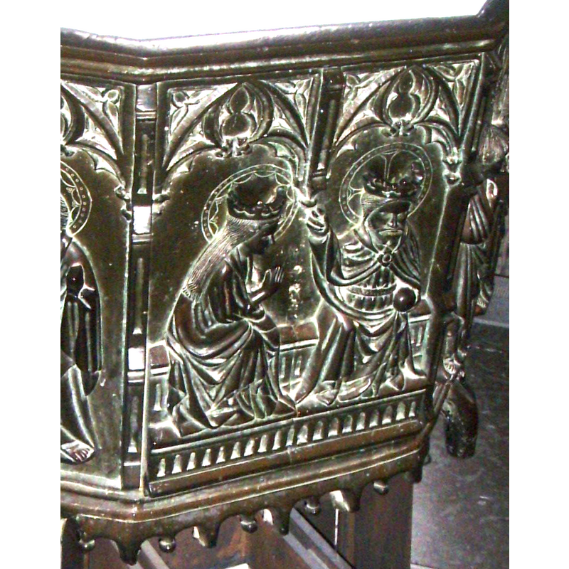 a crowned and haloed (cruciferous halo) Christ seated in majesty holding an orb in his left hand, the right pointing towards Mary's crowned head; Mary bending down at the waist, hands held together in orrant pose, half-turned towards Christ