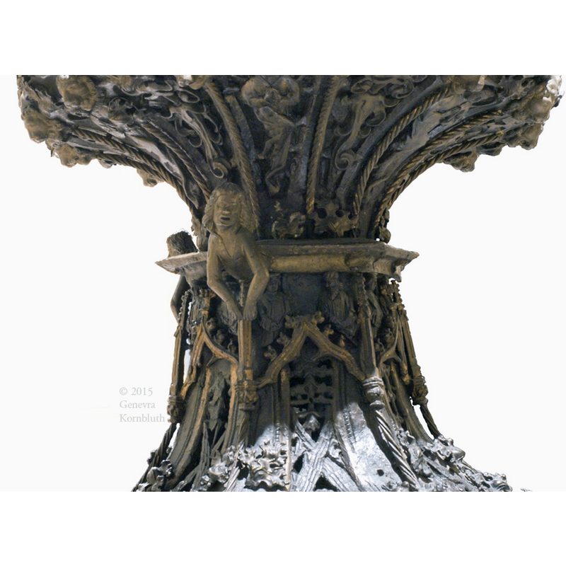 in the spandrels of the arch-heads, upper end of the stem