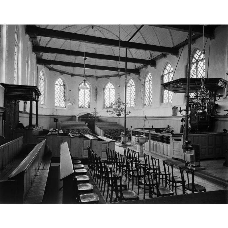 the restored old font is visible on the right, by the pulpit