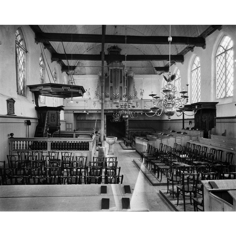 the restored old font is visible on the left, by the pulpit