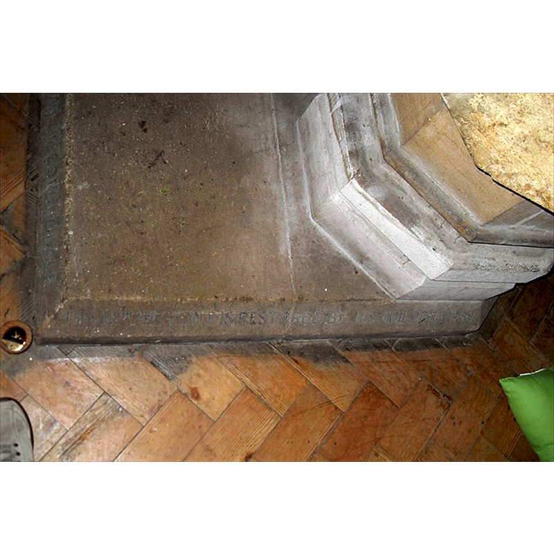 an inscription on the chamfer of the plinth reads: " In Memory of / Norman McCorquodale / This 14th cen[tury] font is restored by his children 1938"