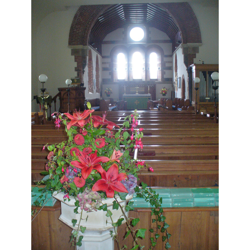 the modern font at the west end of the nave