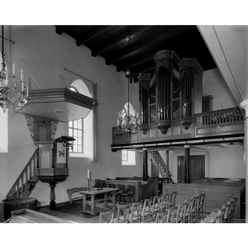 the old font is partially visible in the foreground, left side