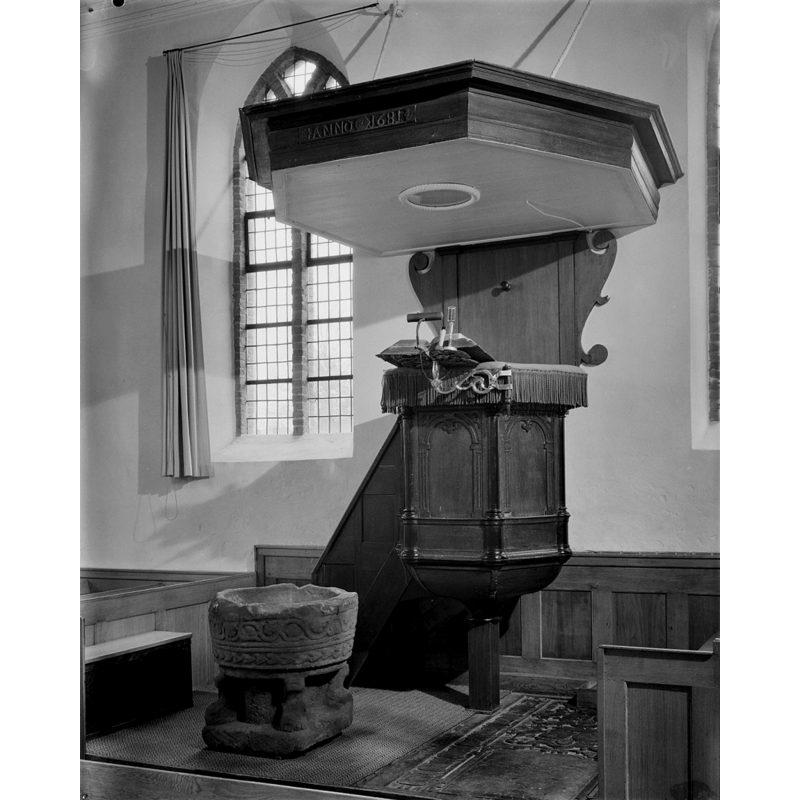 the font is located by the pulpit, a common placement in the Reformed churches of the Netherlands