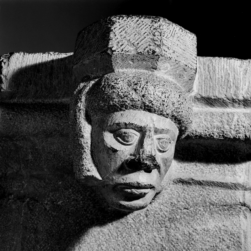 one of the four heads; the face details and the exotic head covering suggests a Moorish or Negroid person