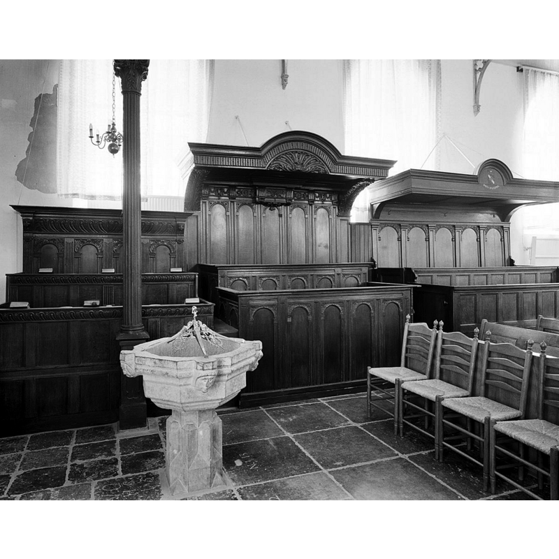 shown here by the Herenbanken, near the west end of the nave [the pulpit, not visible in this photograph, is just west of the font]