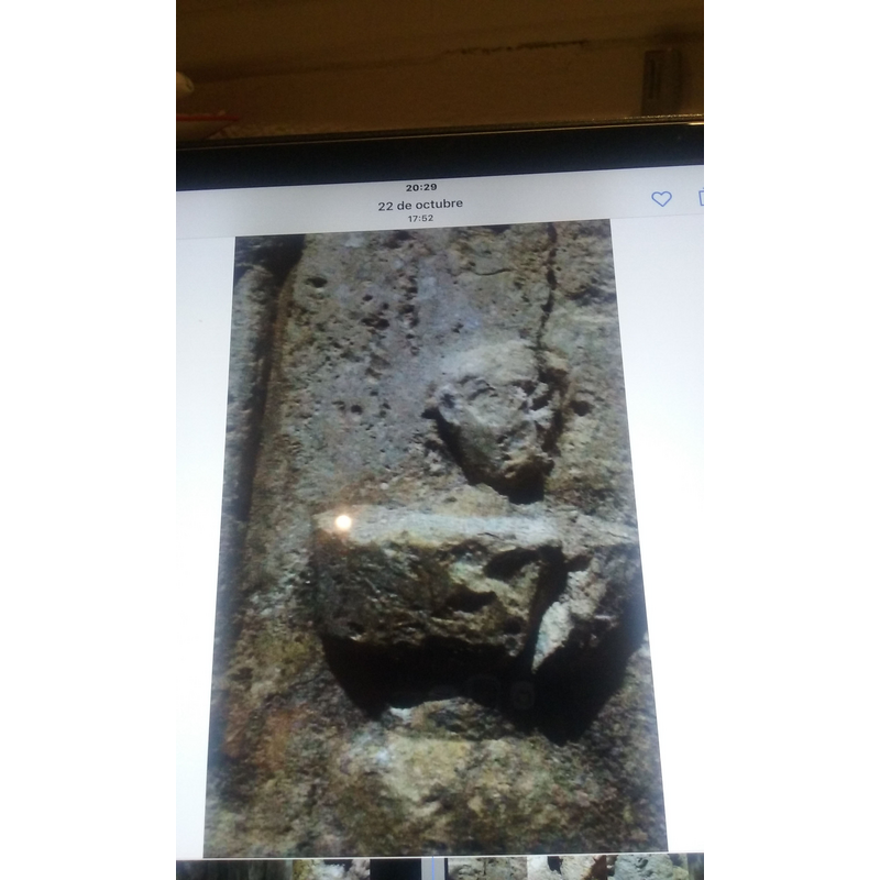 the head of the child (?) protrudes from the baptismal font in the baptismal scene [photograph of a photograph]