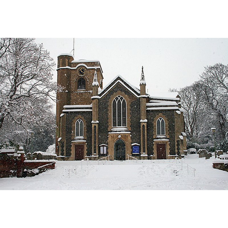 Source caption: "St Martin of Tours, Epsom. The west end was built in 1824 and replaces the earlier building of 1450, of which only the tower remains encased in later stonework."