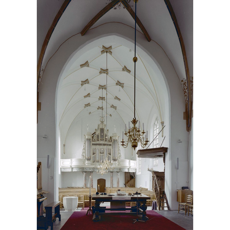 there is a modern stone font on the left [south] side, just west of the chancel arch, opposite the pulpit