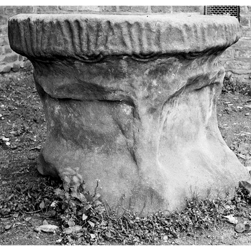notice how the ends wrap around the edge [cf. FontNotes] -- the angle bulges of the base are too worn for identification (lion? / figure?)