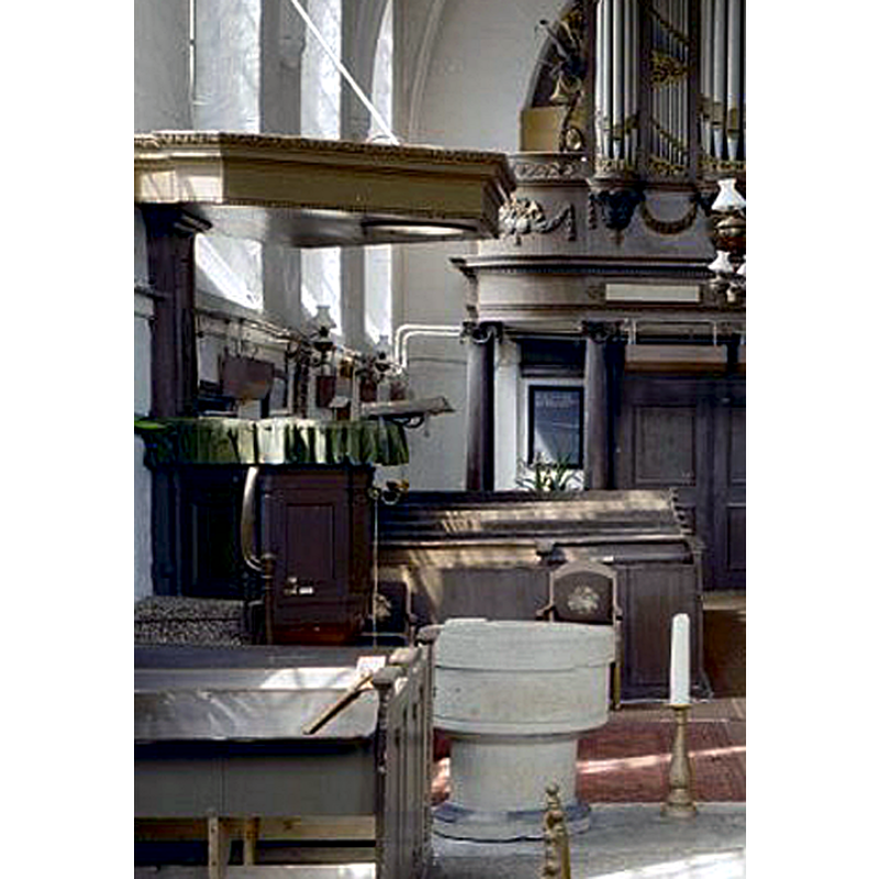 as usual in the Dutch Reformed Protestant churches, the font is located near the pulpit