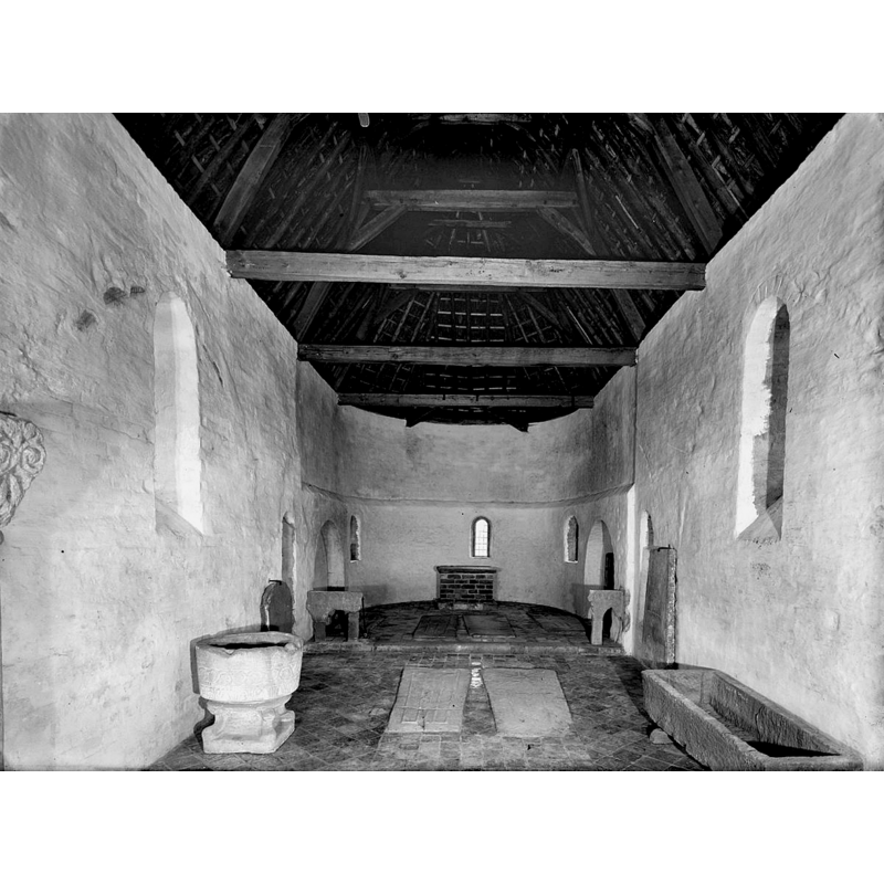 the Jellum font in the interior of the church at Janum [NB: the Janum church would become a museum officially in 1947, but it was already being used as one in 1946, when this photograph was taken]; the font from Jellum is in the foreground, left [north] side