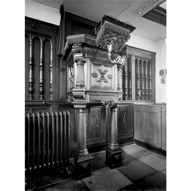 the late ash-tray like font on the front of the pulpit