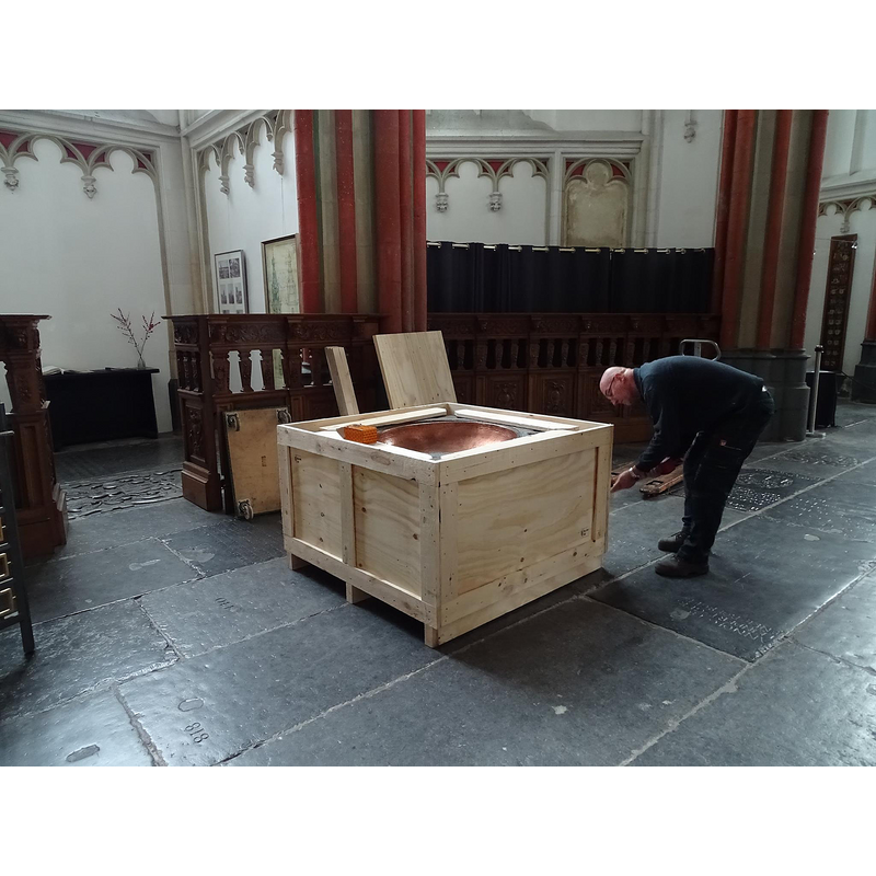 font in a box -- December 2015: the font being prepared for shipping at Sint-Stevenskerk in Nijmegen, its home since 1964; it would be delivered to the Gemeente Wageningen for temporary storage until the restoration at the Nederlands Hervormde Grote of Johannes de Doperkerk is completed