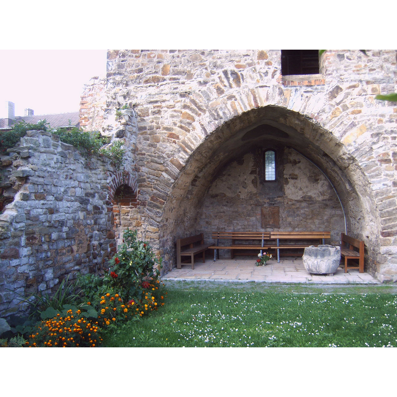 view of the former nave, looking west into the tower -- the restored outer shell of the tower is all that remains of the former parish church building destroyed in WWII; it is used for summer services only