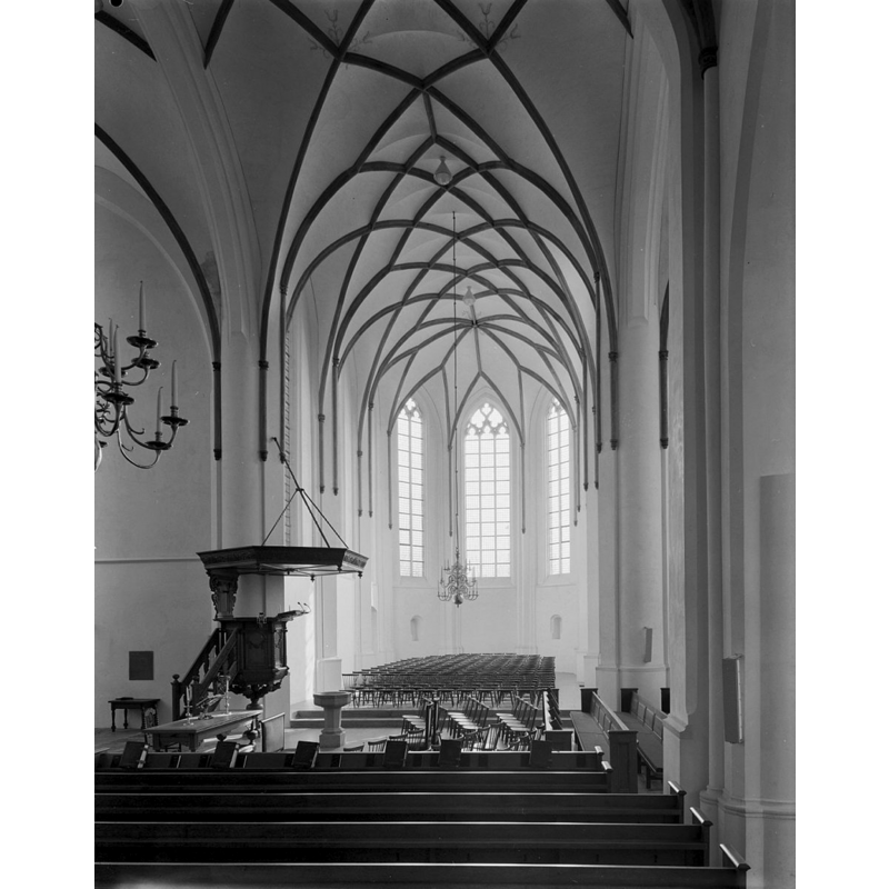 a baptismal font near the pulpit as expected in a Dutch Reformed church