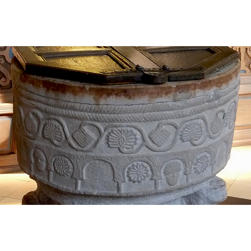 irregular arches (some appear horseshoe shaped) on short simple columns; some of the arches have carved motifs inside, others have incised motifs that may be just later graffiti