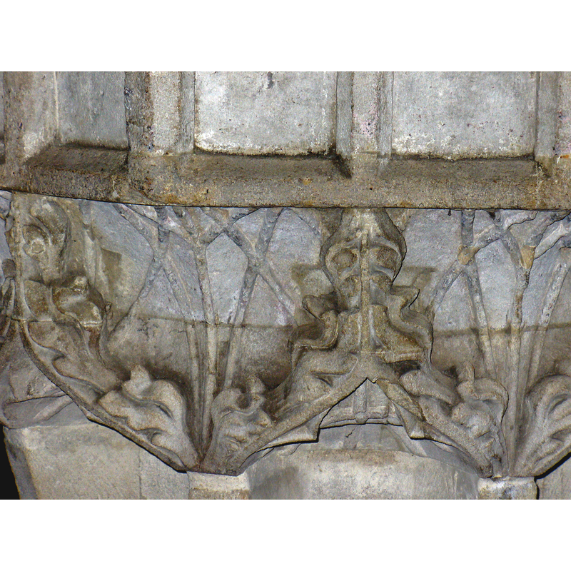 very deeply carved foliated arch-heads -- the spaces below probably served originally as niches for figural sculpture; much damaged by Simpson's time