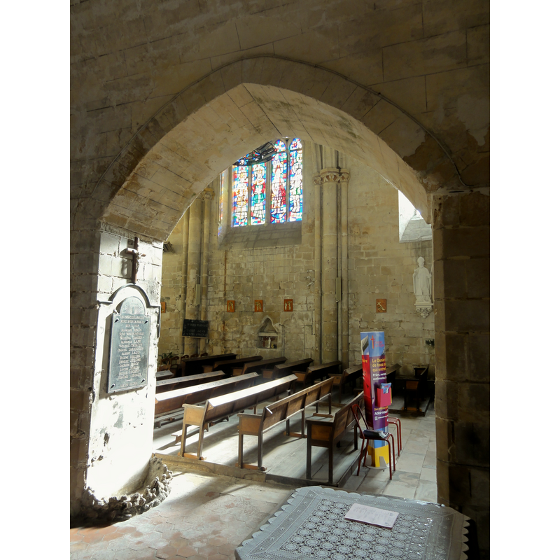 the top of the font cover seen here in the foreground, covered in a crochet cloth cover -- Source caption: "Vue dans le chœur depuis le croisillon sud."