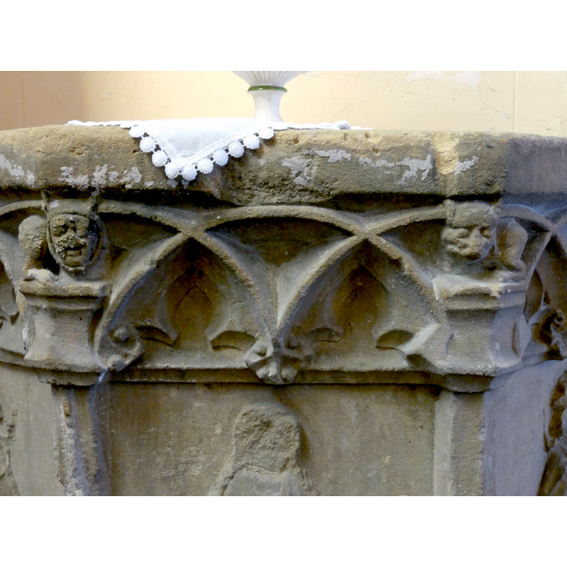 seen here on the left: human head with horned hood, animal body