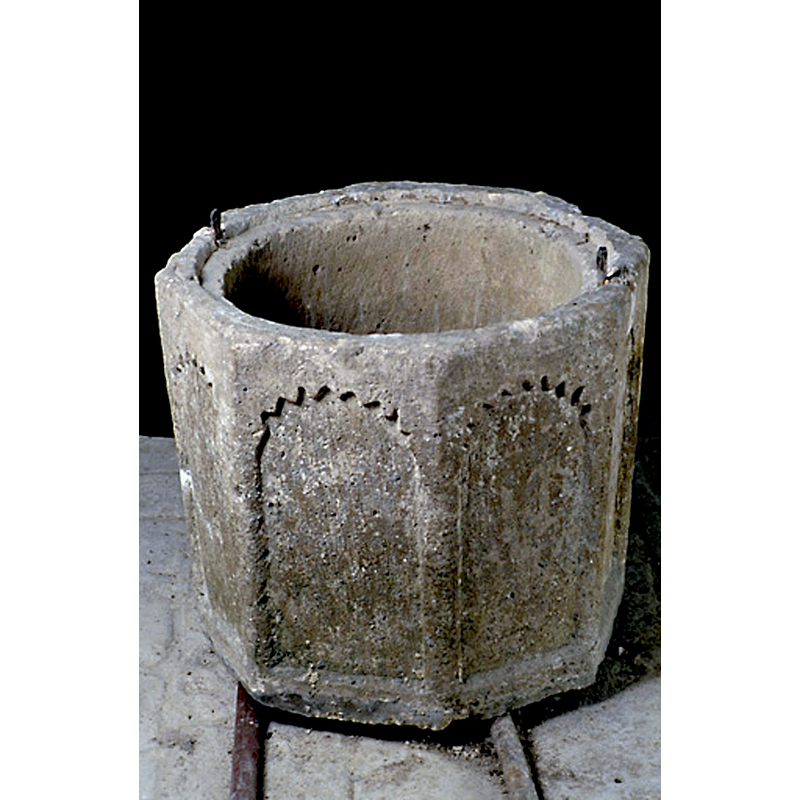 the font in 1993; notice the two metal staples in the upper rim -- the font is raised on two rollers or pipes