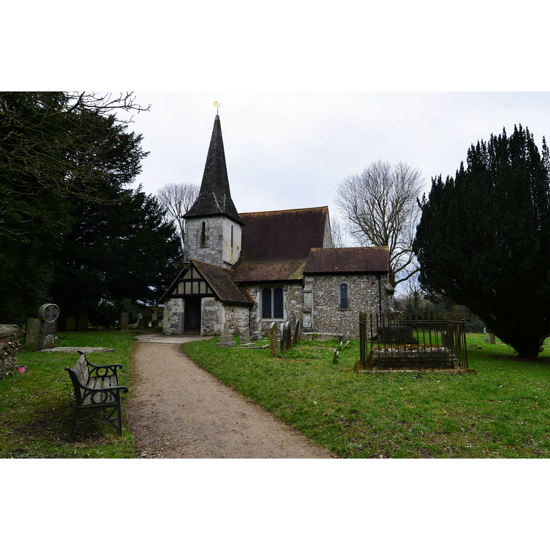 Source caption: "Chaldon: The Church of St Peter and St Paul. The church is Norman with the famous Chaldon Mural on the west wall; it was later added to. The west tower and spire date from 1843."