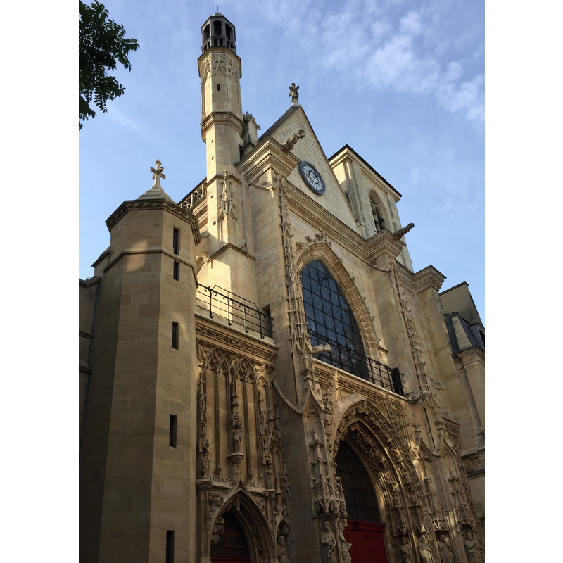 the west side of the church on rue Saint-Martin