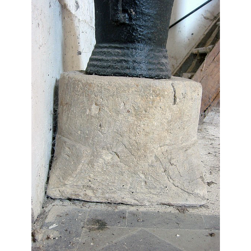 on the lower corners of the stone base