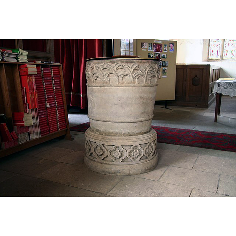 Source caption: "St.Peter's font. Early English, mid-13th century tub font with stiff-leaf motif, raised on a later base"