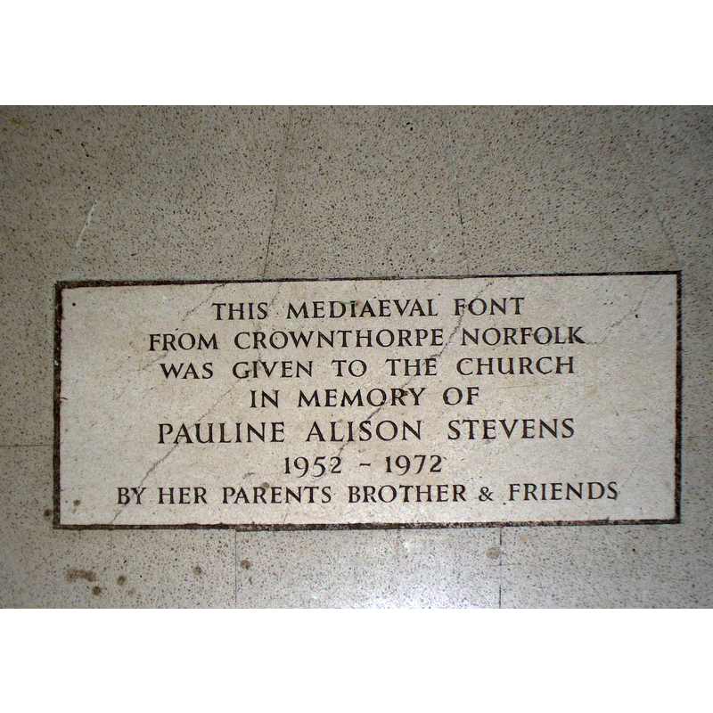 the plaque states the original location of the font that is now at Amersham St. Mary's: Crownthorpe, Norfolk