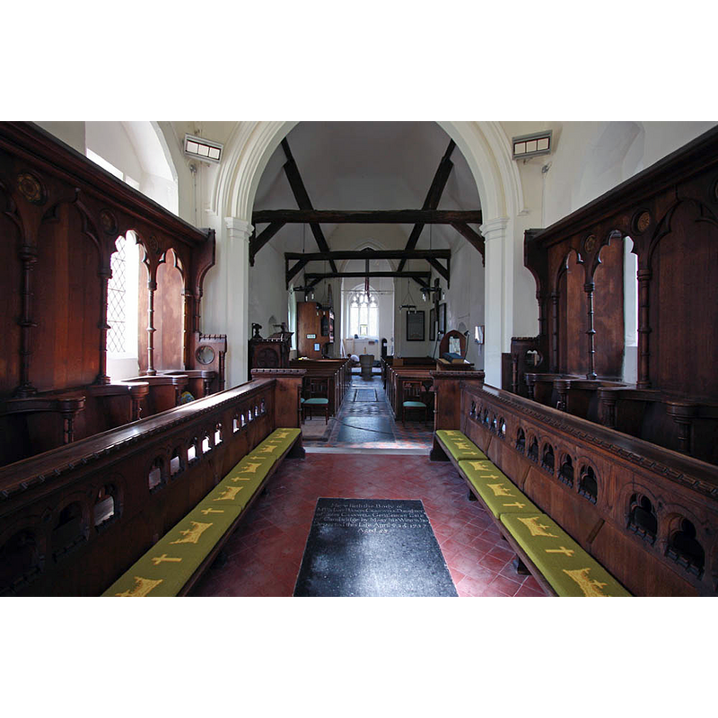 the font is visible at the far [west] end of the nave